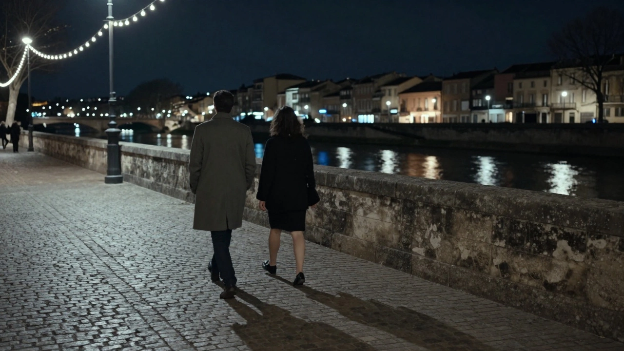 A couple walking peacefully along the River Languedoc at night, connected in quiet moments.